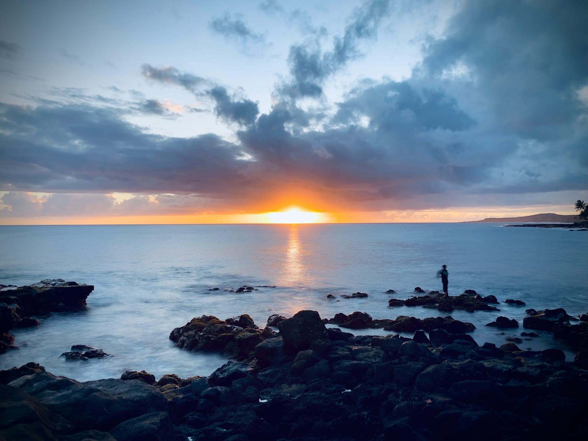 Calm Pacific water held in golden-hour light